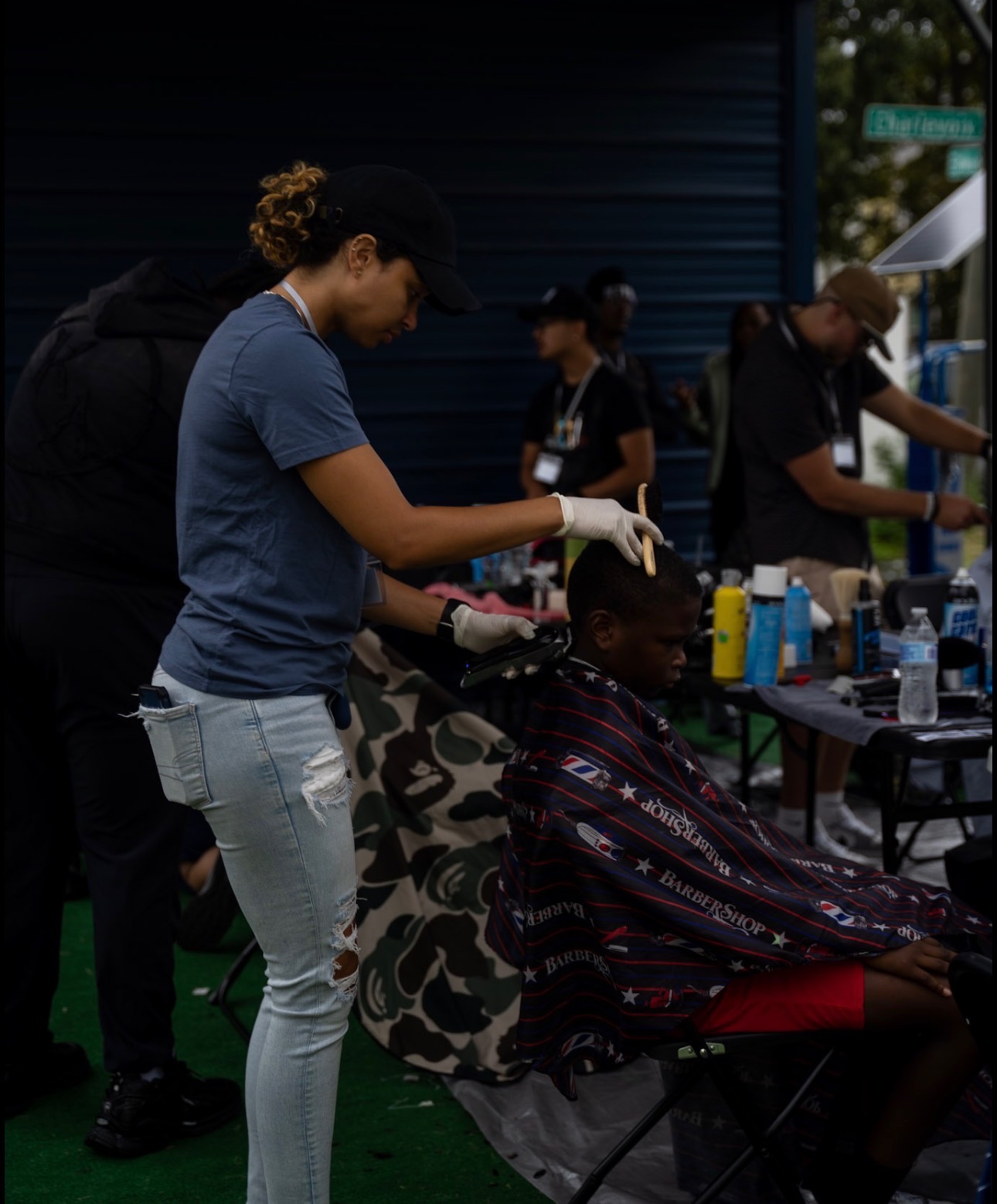 Barber giving a fresh cut at community event